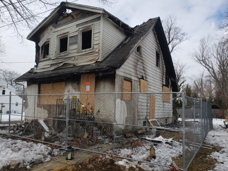 Officials check for smoke alarms after fatal fire