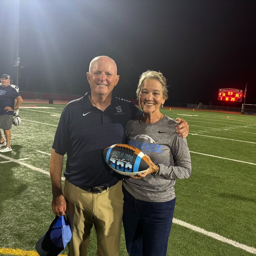 Veteran football coach reaches historic win milestone